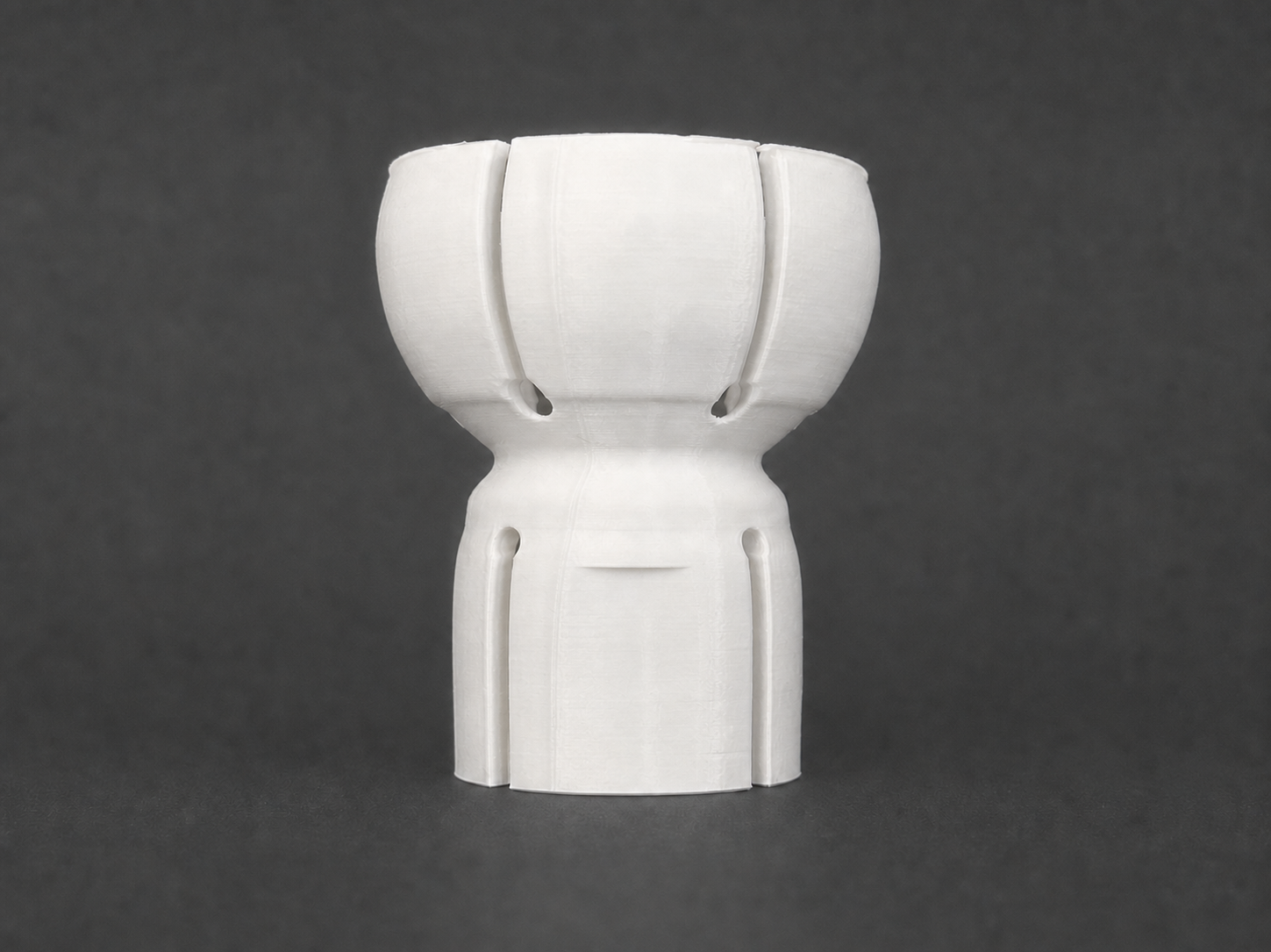 Front view of the first physical white BallBack standard-grip PETG prototype with its legacy embossing digitally removed